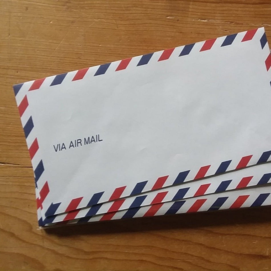 Red, white, and blue stack of letters