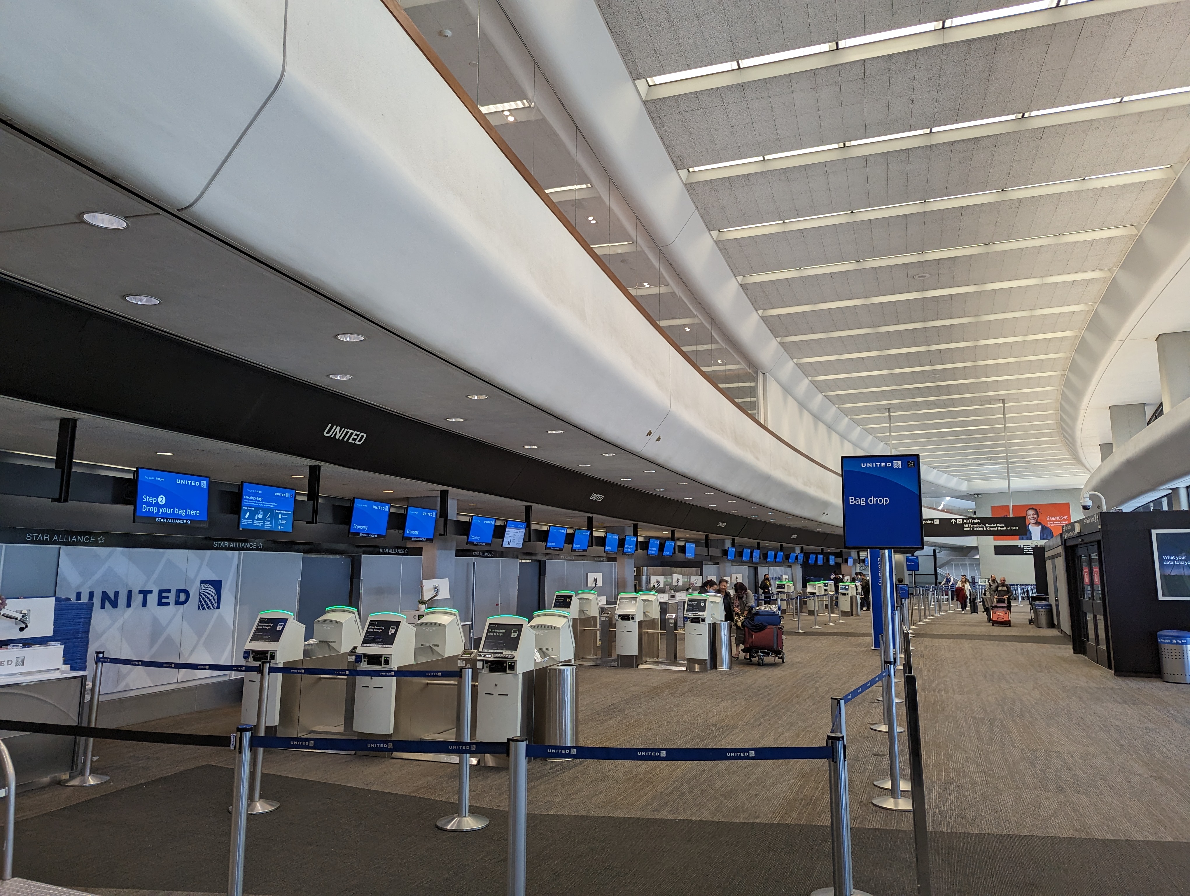 The long, white interior of an airport