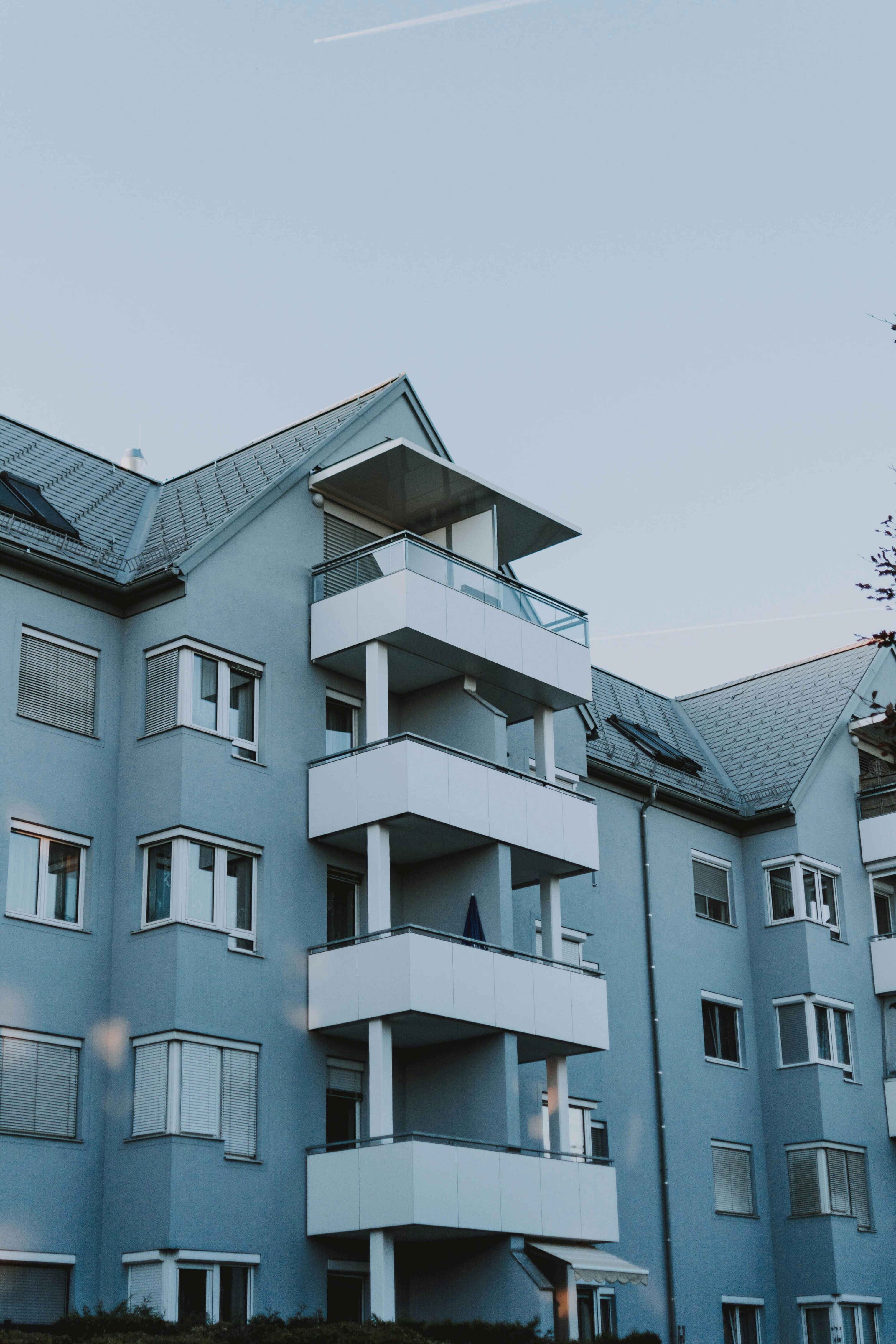 A tall, blue housing structure