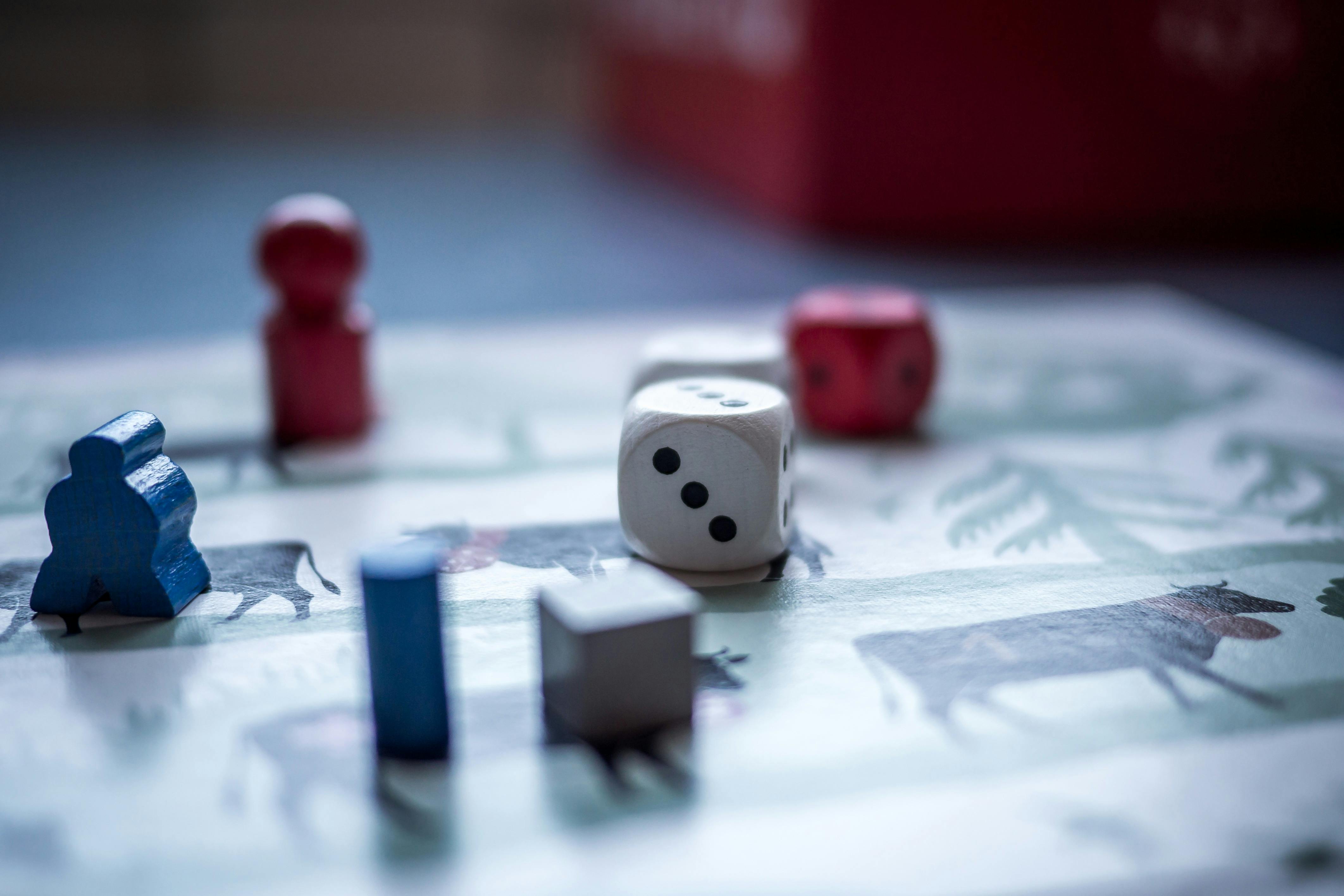Various board game pieces on an illustrated game board