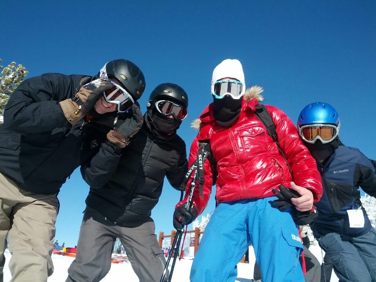 A group of skiiers posing for the camera