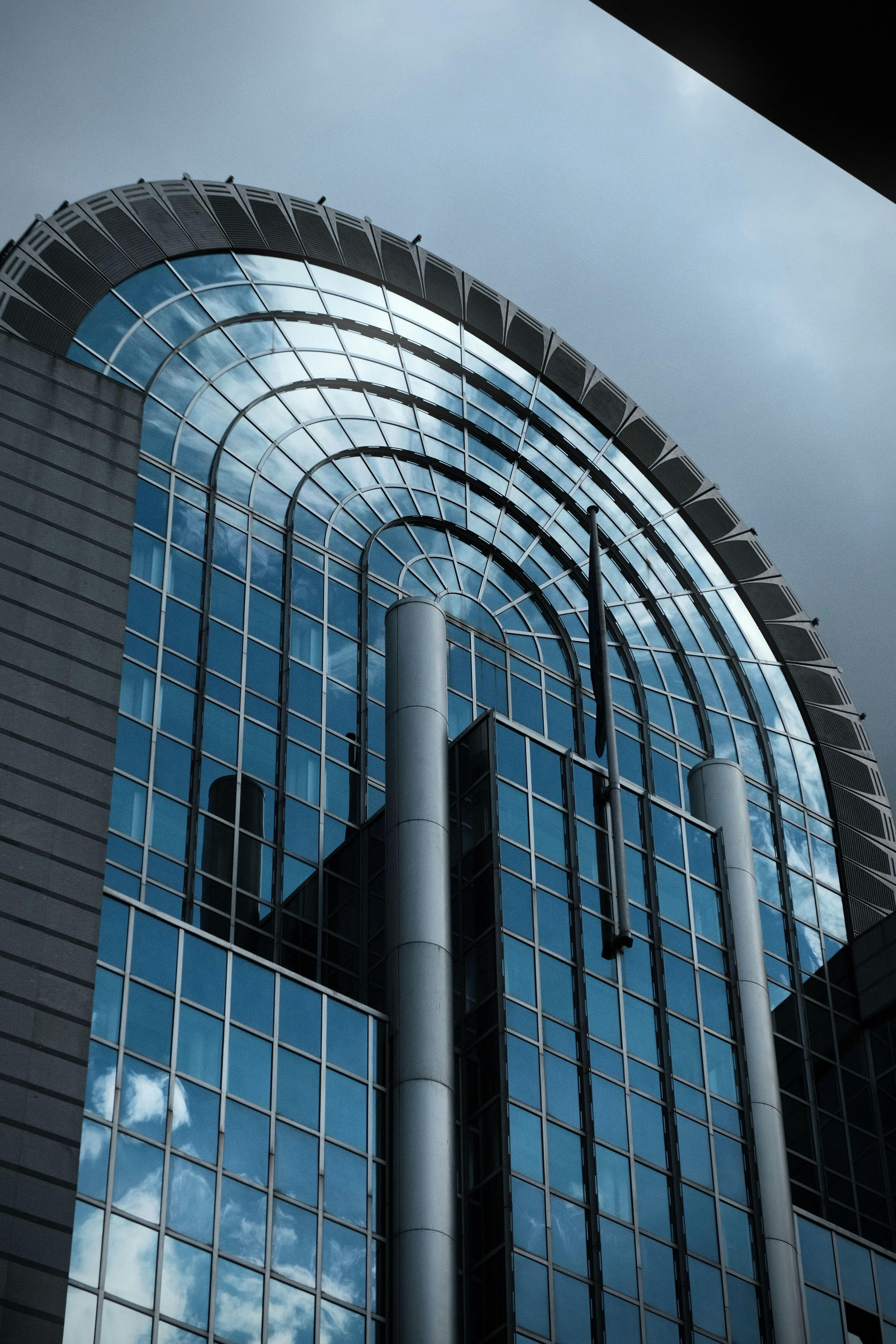 Close up of a glass face of the European Parliament building in Burssels