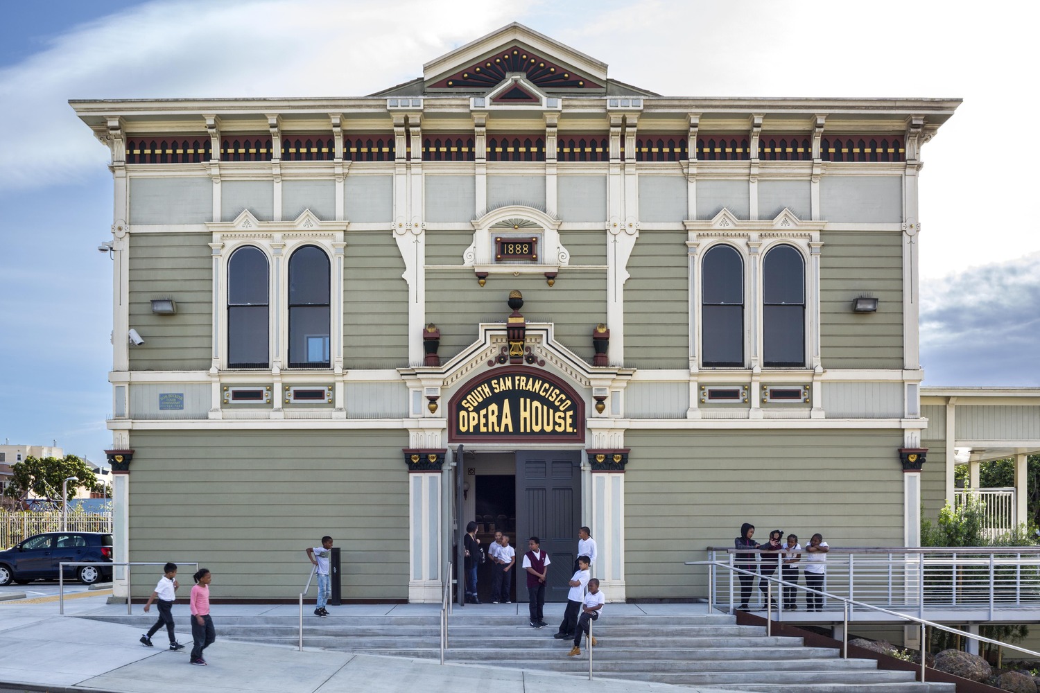 The mint-colored, ornate facade of an opera building