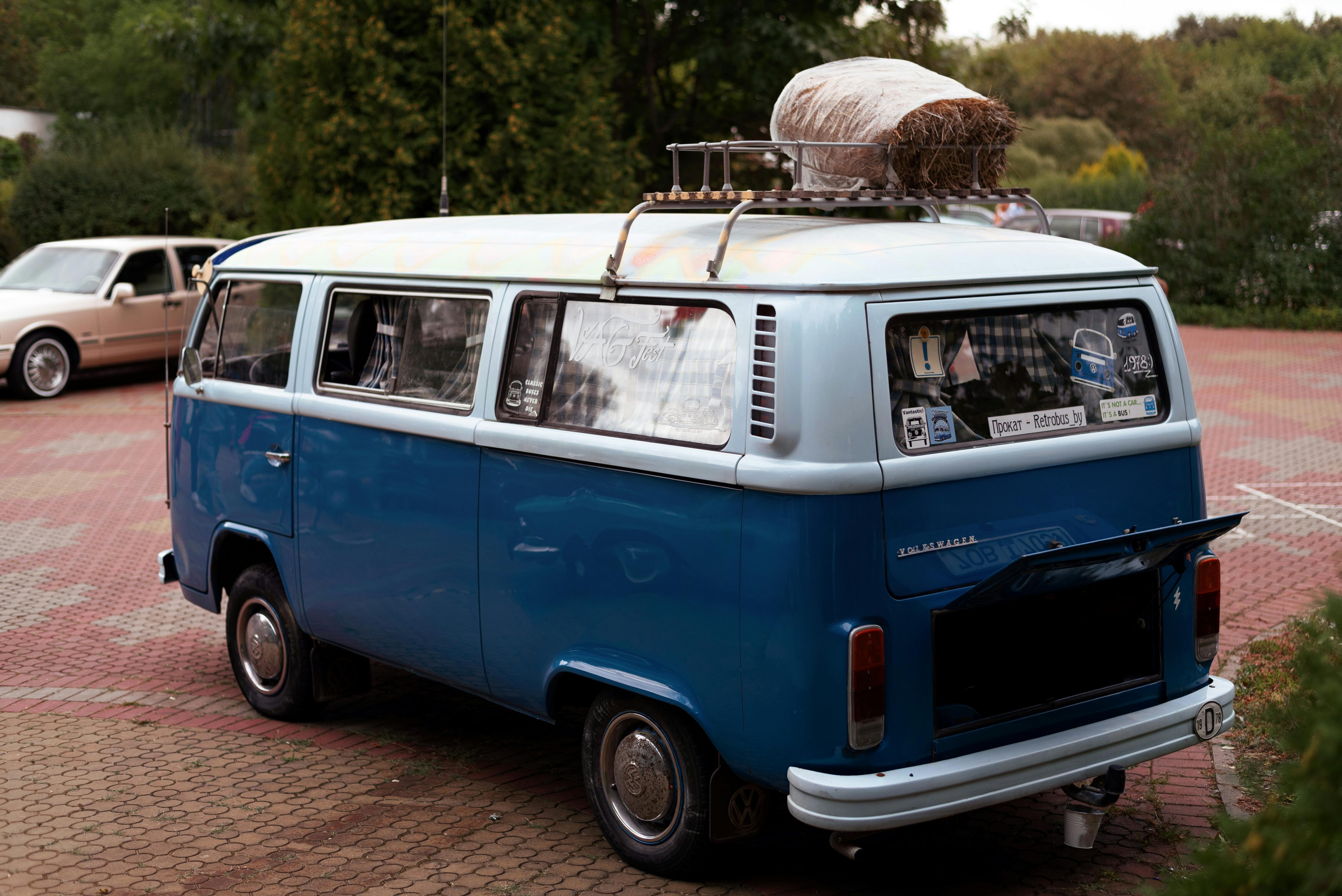 A vintage blue van shot from the back